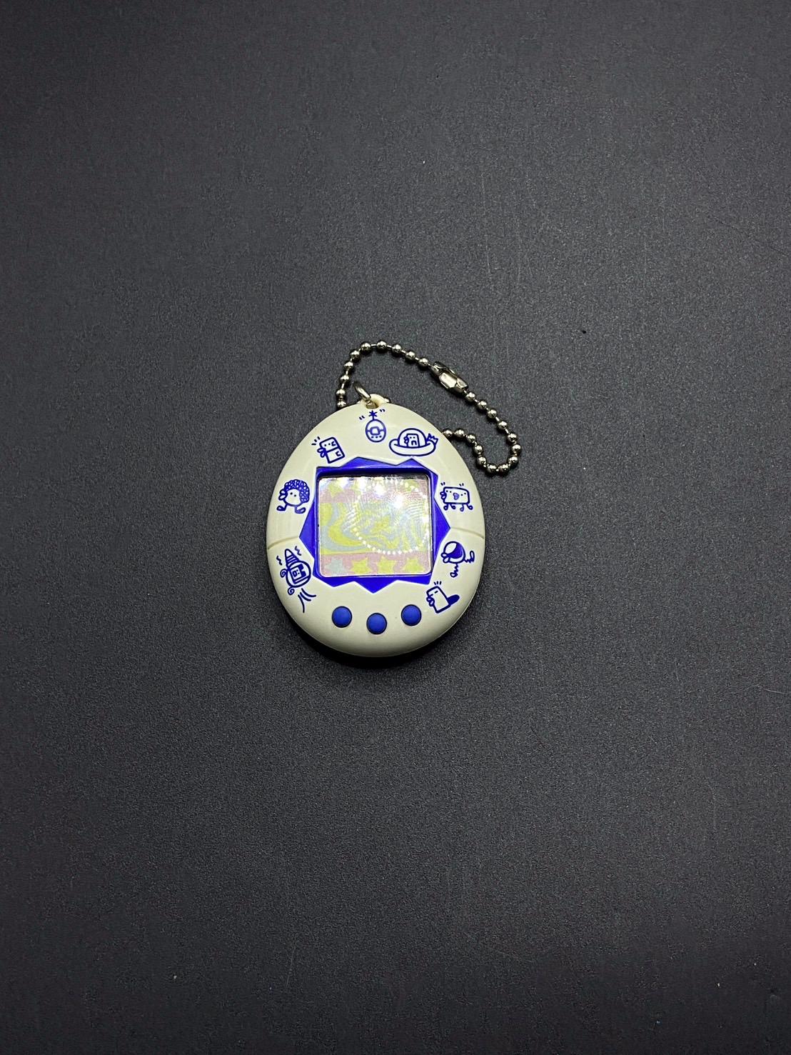 SKU B140P863TA | Bandai Original Tamagotchi White New Species