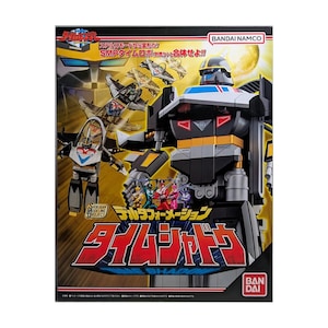 May include: A Bandai Namco Time Shadow model kit box featuring a large black and grey robot with gold accents, a smaller jet-like vehicle, and five small figures in red, blue, green, pink, and violet. The box displays Japanese text and graphics.