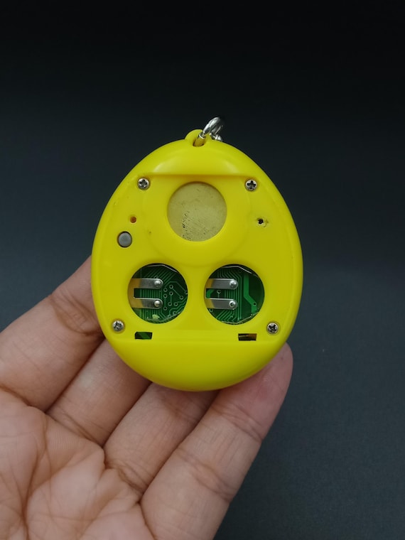SKU B697P7259 | Tamagotchi P1/P2 Yellow Orange Bandai Japan - Etsy