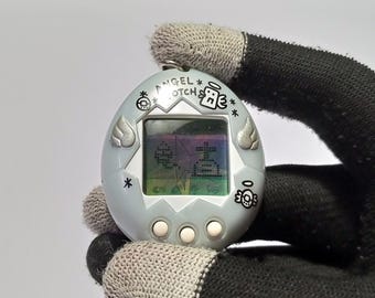 692123010 | Tamagotchi Angel gotch Silver Japanese Version V-pet Bandai