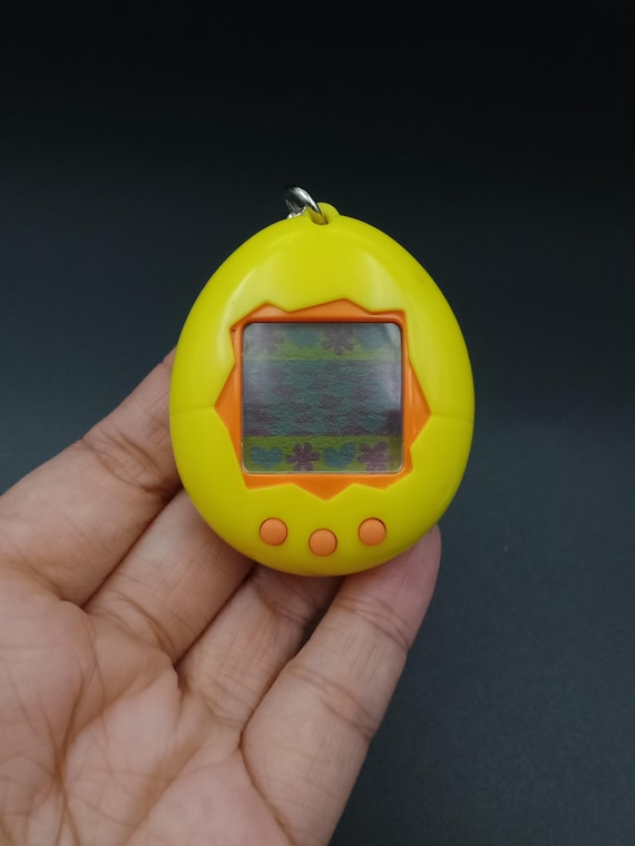 SKU B697P7259 | Tamagotchi P1/P2 Yellow Orange Bandai Japan - Etsy