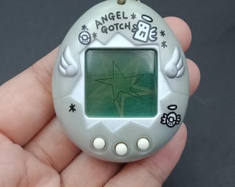 SKU B913P11653TA8 | Bandai Tamagotchi Angel Gotch Silver - Etsy Canada