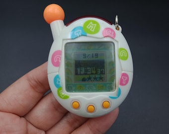 SKU YU275 | Bandai Japan Tamagotchi V4 Connection Plus Beads White