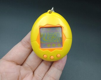 SKU YU120 | Tamagotchi P1/P2 Yellow Orange Bandai Japanese