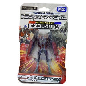 以下が含まれることがあります： トランスフォーマープライムのスタースクリームのアクションフィギュア。オリジナルのブリスターパッケージ入り。透明なプラスチック越しにグレーと赤のロボットが見える。台紙には日本語のテキスト、タカラトミーのロゴ、オプティマスプライムのグラフィックが印刷されている。