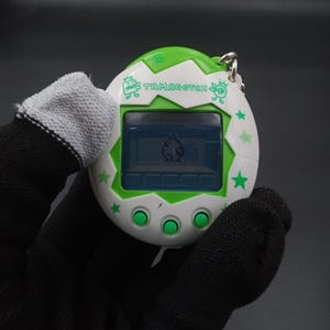 SKU B1071P13320 TA8 | Tamagotchi Osuchi and Mesutchi Green Bandai