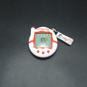 SKU B740P7858 | Bandai Tamagotchi Hanerutchi Red Keitama