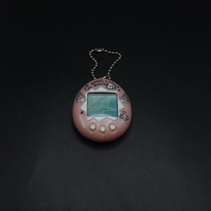 SKU | Bandai Tamagotchi Tenshitchi Angel Pearl Pink VirtualPet Angelgotchi