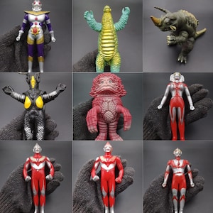 May include: A collection of nine vintage action figures, featuring various colorful monster and superhero designs. The figures are held against a dark background, showcasing their detailed features and vibrant paint schemes. The collection includes a variety of characters.