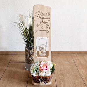 Wooden welcome sign with saying wooden stele