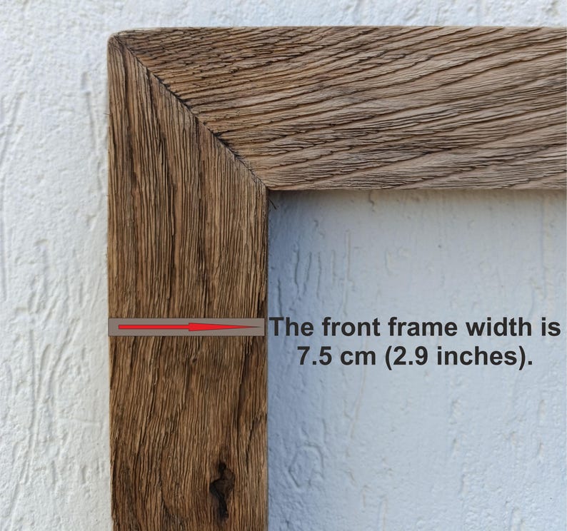 May include: Close-up of a rustic wooden picture frame corner. The front frame width is 2.9 inches. The wood has a natural, weathered appearance with visible grain and texture, showcasing a warm, brown color.