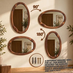 May include: Four irregular oval mirrors with dark wood frames shown in vertical and horizontal orientations with 90 and 180 degree rotation arrows. Includes two wall anchors and two screws. Text reads: 4 DIFFERENT HANGING WAYS FOR ALL OUR MIRRORS.