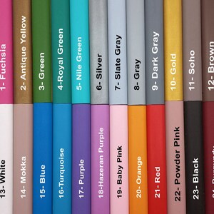 May include: A color chart with 24 different colors, each labeled with a number and a color name. The colors are arranged in two rows of 12 colors each. The colors include fuchsia, antique yellow, green, royal green, nile green, silver, slate gray, gray, dark gray, gold, soho, brown, white, mokka, blue, turquoise, purple, hazeran purple, baby pink, orange, red, powder pink, black, and burgundy.
