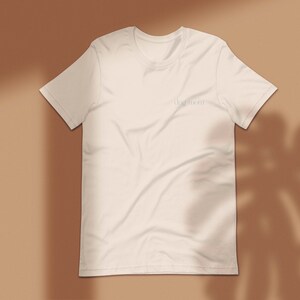 May include: A white t-shirt with the text "dog mom" printed on the front.