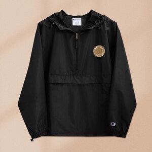 May include: Black windbreaker jacket with a zipper closure and a small brown patch on the left chest that says "Bring My Dog".