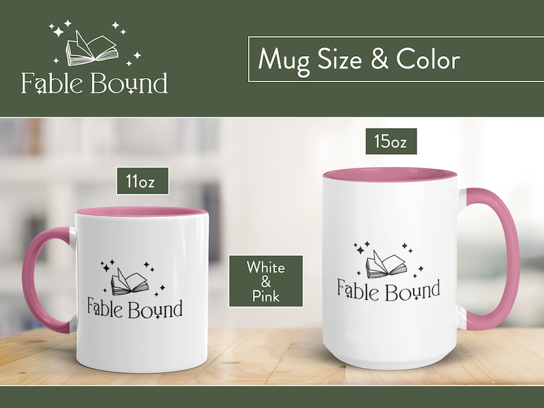 May include: Two white ceramic mugs with pink accents. The mugs feature a black and white illustration of an open book with stars. The text "Fable Bound" is printed on the mugs. The mugs are available in 11oz and 15oz sizes.