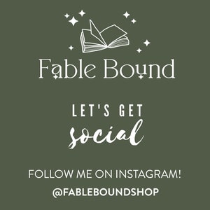May include: A white graphic of an open book with stars on a dark green background. The text "Fable Bound" is below the book. The text "Let's get social" is below the text "Fable Bound". The text "Follow me on Instagram! @FABLEBOUNDSHOP" is at the bottom of the image.