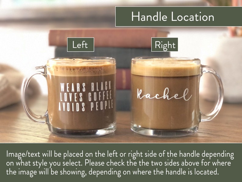 May include: Two clear glass coffee mugs with handles. The mug on the left has the text "WEARS BLACK LOVES COFFEE AVOIDS PEOPLE" printed on it. The mug on the right has the name "Rachel" printed on it. The mugs are on a wooden surface.