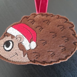 Christmas hedgehog. Hedgehog in Santa hat. Festive hedgehog decoration. Tree decoration. Woodland animal Christmas gift