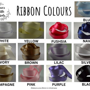 May include: A selection of satin ribbon colours are displayed, including white, yellow, fuchsia, navy, ivory, brown, lilac, silver, champagne, pink, purple, and black. The text "Ribbon Colours" is shown. Ribbons are 25mm in thickness.