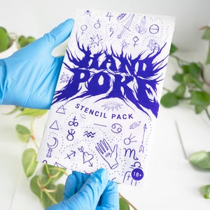 May include: A white stencil pack with blue graphics and text, held by hands wearing blue gloves. The text reads "HAND POKE STENCIL PACK" with various symbols and an "18+" age restriction. Green plants are visible in the background.