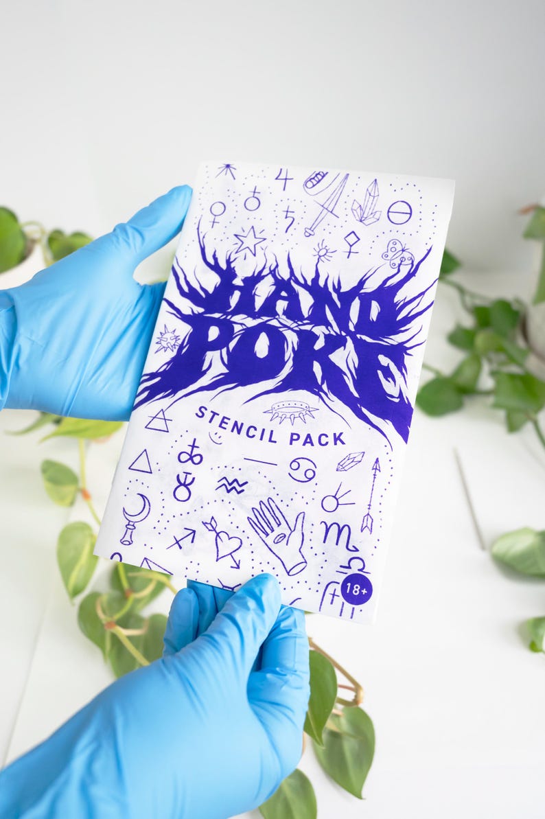 May include: A white stencil pack with blue graphics and text, held by hands wearing blue gloves. The text reads "HAND POKE STENCIL PACK" with various symbols and an "18+" age restriction. Green plants are visible in the background.