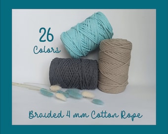 May include: Three spools of braided 4 mm cotton rope in teal, gray, and beige. The image includes the text "26 Colors" and "Braided 4 mm Cotton Rope". Decorative dried flowers are in the foreground. Ideal for macrame and other crafts.