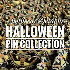 May include: A close-up of a collection of Halloween-themed enamel pins featuring a black and yellow moth with a jack-o-lantern face. The pins are arranged in a random pattern and the text "Apothecary Octopus HALLOWEEN PIN COLLECTION" is visible in the center of the image.