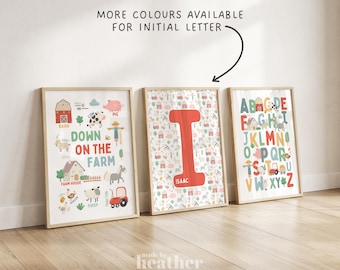 May include: Three framed art prints with a farm theme. One print says "Down on the Farm" with farm animals and a red tractor. The second print has a large red letter "I" with the name "Isaac". The third print is an alphabet chart.
