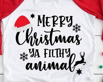 May include: White and red raglan style Christmas shirt with the text "Merry Christmas ya filthy animal" in black script. The shirt features a Santa hat, snowflakes, a reindeer, and a star.