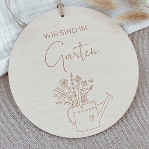 Wooden sign "We are in the garden"
