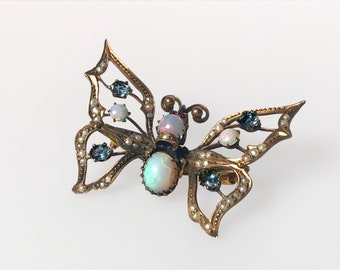 Victorian multi gem butterfly brooch Gold and Silver with Gems Opal Seed Pearl Aquamarine Ruby 19th Century