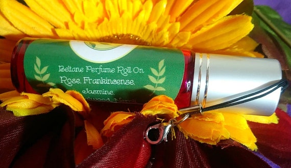 Beltane Perfume Roll-On 10 ML with Ruby Zoisite Chips.