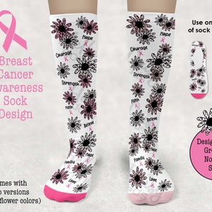 May include: A pair of white socks with a pink ribbon and floral design. The socks feature words like "Hope", "Courage", "Strength", "Faith", "Believe", "Family", and "Love". The socks are designed for breast cancer awareness.