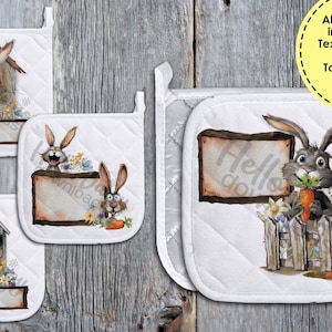 May include: Set of four white quilted pot holders with a bunny rabbit theme. Each pot holder features a different bunny rabbit design with a wooden sign that says "Hello do".
