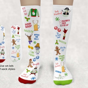 May include: A pair of white Christmas themed socks with a variety of festive designs, including a gingerbread man, a snowman, a reindeer, and a Christmas tree. The socks have the text "Bah Humbug!" and "Naughty" printed on them.