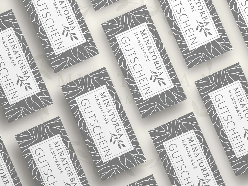 May include: A set of gray gift certificates with a white floral design and the text "MINATORBA HANDMADE GUTSCHEIN".