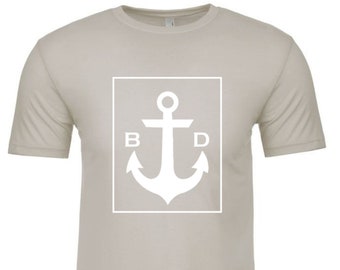 Below Decks T-shirt with white BelowDecks logo.