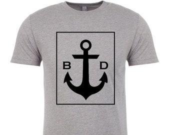 Below Decks T-shirt with black BelowDecks logo.