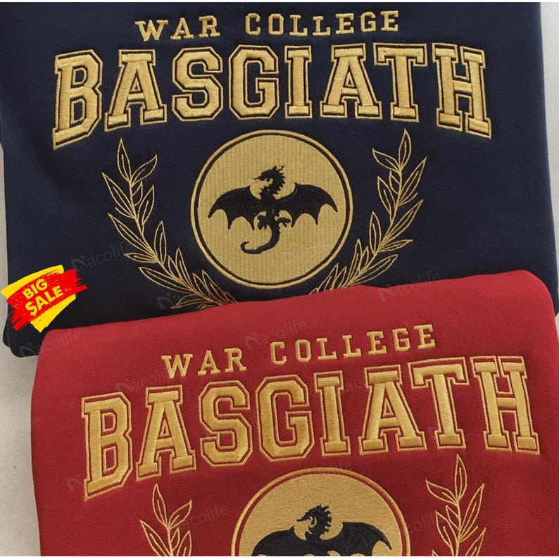 May include: Two sweatshirts, one navy blue and one red, with gold embroidered text and a dragon emblem. The navy blue sweatshirt has the text "WAR COLLEGE BASGIATH" and a dragon emblem inside a circle. The red sweatshirt has the same text and emblem.