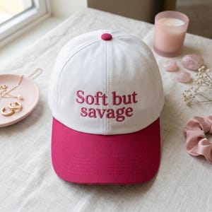 May include: A set of three ceramic vases in varying heights and shapes. The vases are glazed in a matte white finish, offering a minimalist aesthetic. The tallest vase is approximately 10 inches high.