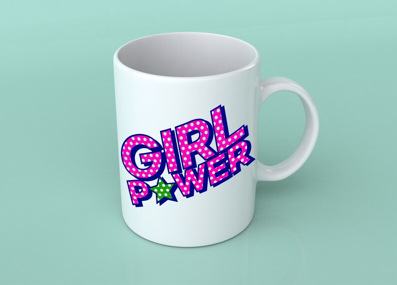 May include: White ceramic mug with a pink and blue "GIRL POWER" design with white polka dots and a green star.