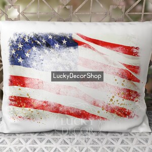 May include: White pillow with a distressed American flag design in red, white, and blue with gold glitter accents. The text "LuckyDecorShop" is printed on the pillow.