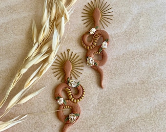 Desert Goddess snake earrings with large brass sun charm / Polymer clay snake earrings / Floral detail clay snakes / Handmade clay dangles
