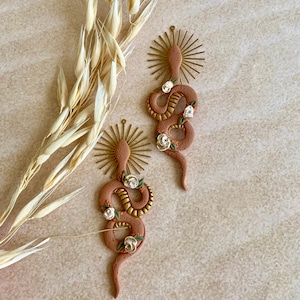 Desert Goddess snake earrings with large brass sun charm / Polymer clay snake earrings / Floral detail clay snakes / Handmade clay dangles