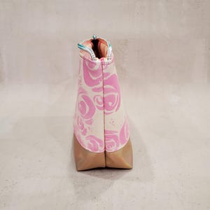 May include: A set of three ceramic mugs with a speckled, matte finish. The mugs are in shades of cream, light gray, and dark gray. Each mug has a simple, minimalist design, perfect for coffee or tea.