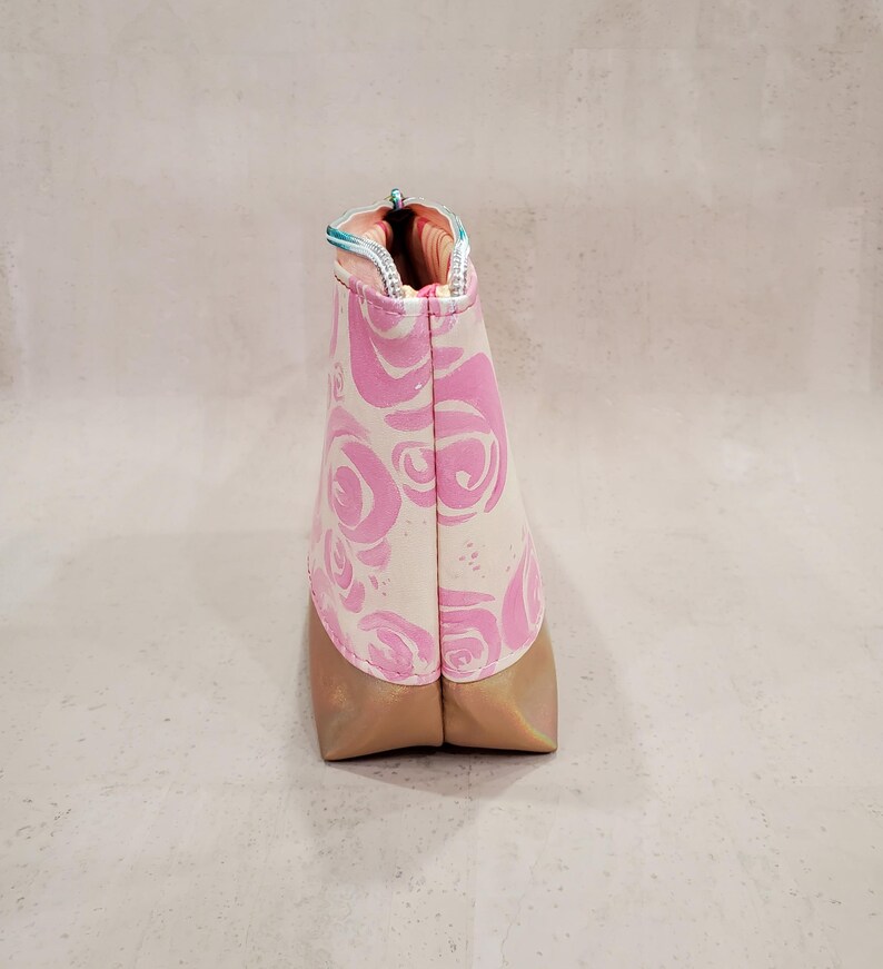 May include: A set of three ceramic mugs with a speckled, matte finish. The mugs are in shades of cream, light gray, and dark gray. Each mug has a simple, minimalist design, perfect for coffee or tea.