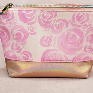 May include: A white ceramic mug with a black handle and the text "But First, Coffee" in a black, bold font. The mug is sitting on a wooden surface. The mug is approximately 4 inches tall.