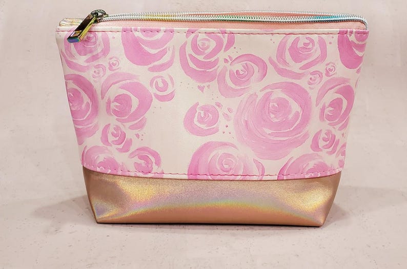 May include: A white ceramic mug with a black handle and the text "But First, Coffee" in a black, bold font. The mug is sitting on a wooden surface. The mug is approximately 4 inches tall.