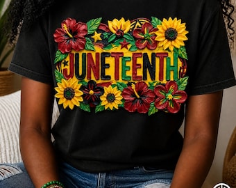 May include: Black t-shirt featuring the word "JUNETEENTH" in red, yellow, and green, surrounded by colorful flowers and leaves. The flowers include sunflowers and hibiscus. The shirt is a crew neck.